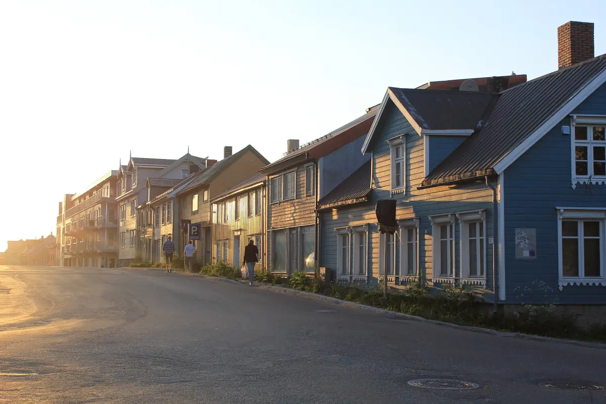 Midnight sun over the wooden houses of northern Storgata